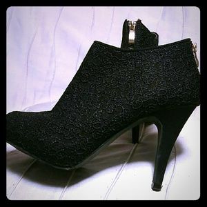 Black heels with embroidered design